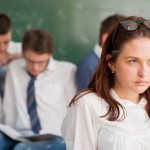 Moody,Girl,Student,Standing,In,A,Class
