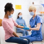 Coronavirus,Vaccination.,Nurse,Vaccinating,African,Teenager,Girl,Against,Covid-19,Injecting