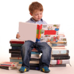 Child-sat-on-books-reading