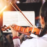 Girl,Students,Playing,Violin,In,The,Group.