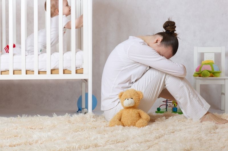 child and mother suffering from postnatal depression
