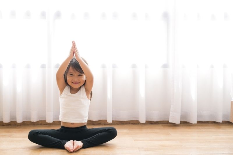 child practising yoga