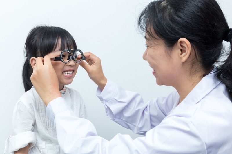 doctor assessing eye problems in child
