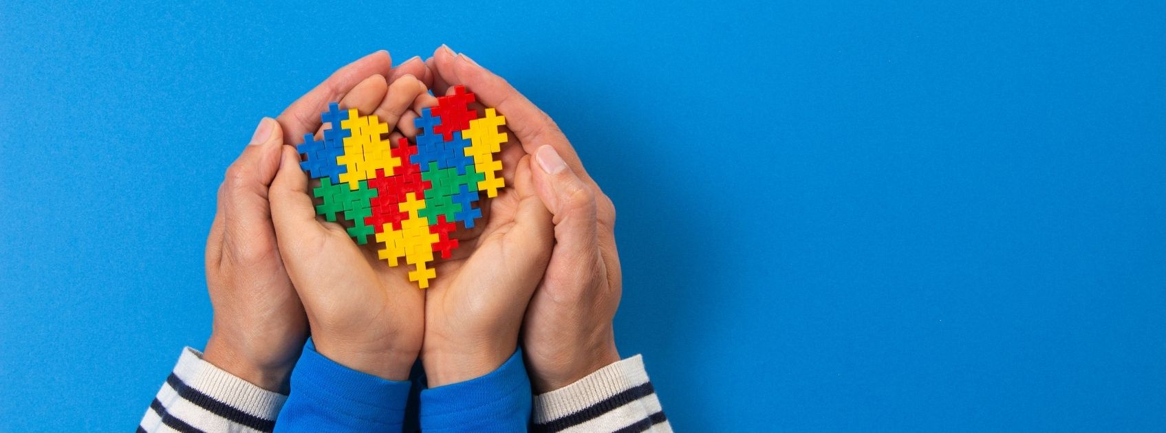 hands holding a heart for world autism awareness day