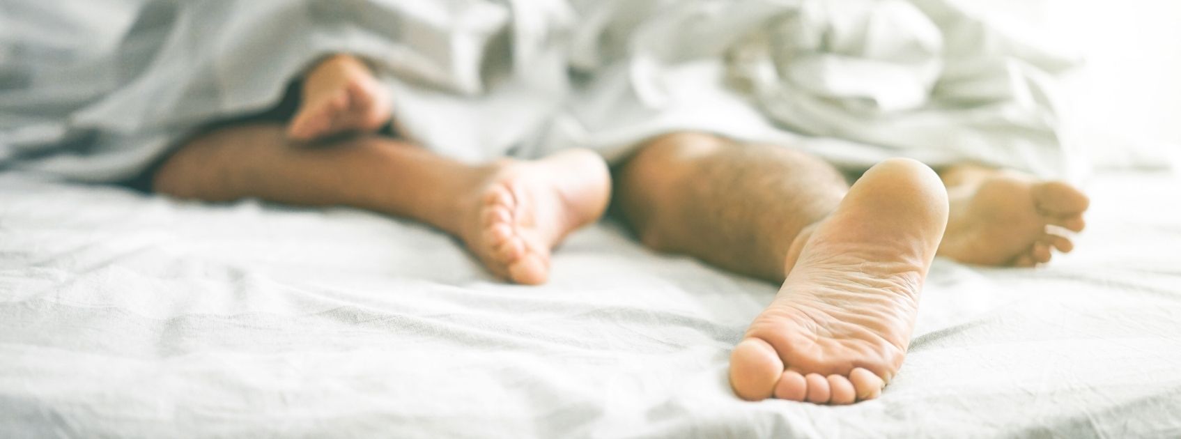 feet under covers in bed