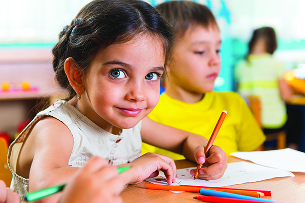 Group of cute little prescool kids drawing