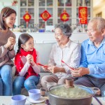 Happy,Asian,Family,Celebrating,Chinese,New,Year,At,Home