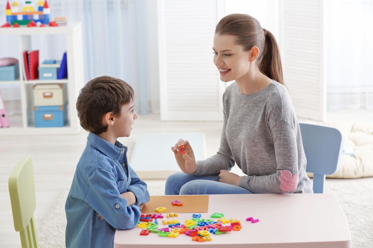 kid learning with teacher