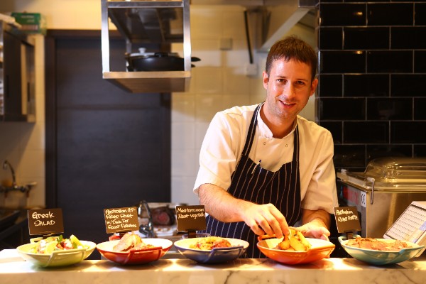 Tom cooking with Invisible Kitchen