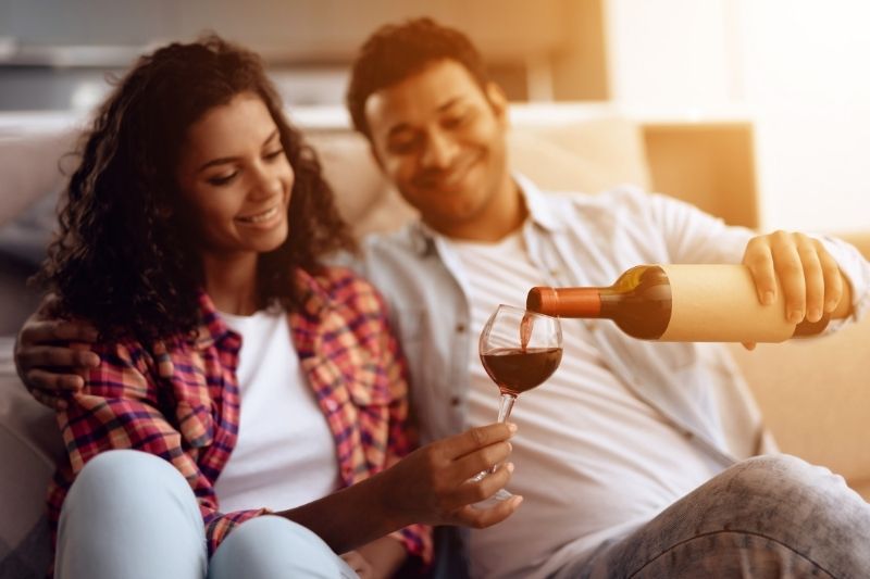 A couple drinking wine at home