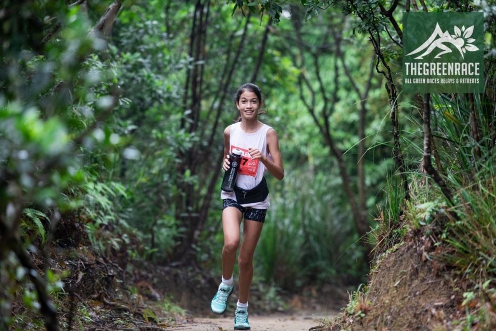 A teenage girl Running through a forest 