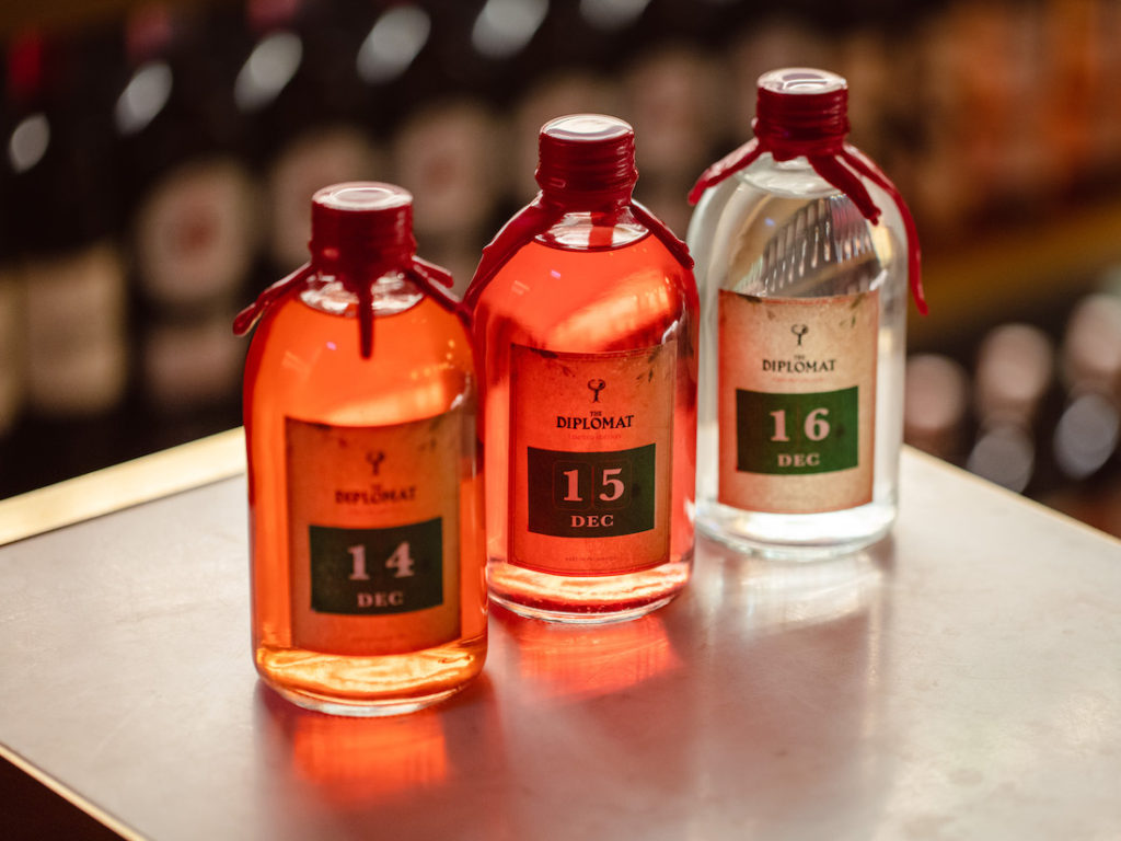 three Glass bottles with number labels