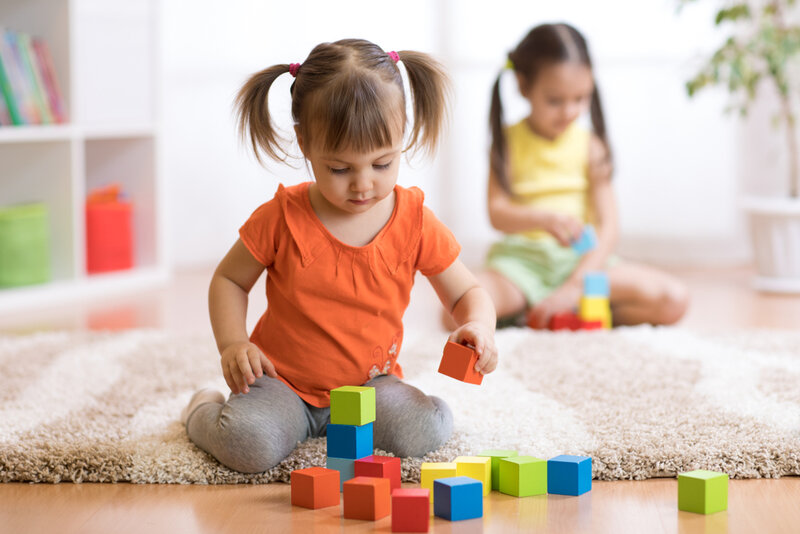 small girl playing with blocks