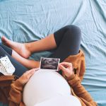 Pregnant,Woman,Holding,Ultrasound,Image.,Concept,Of,Pregnancy,,Health,Care,