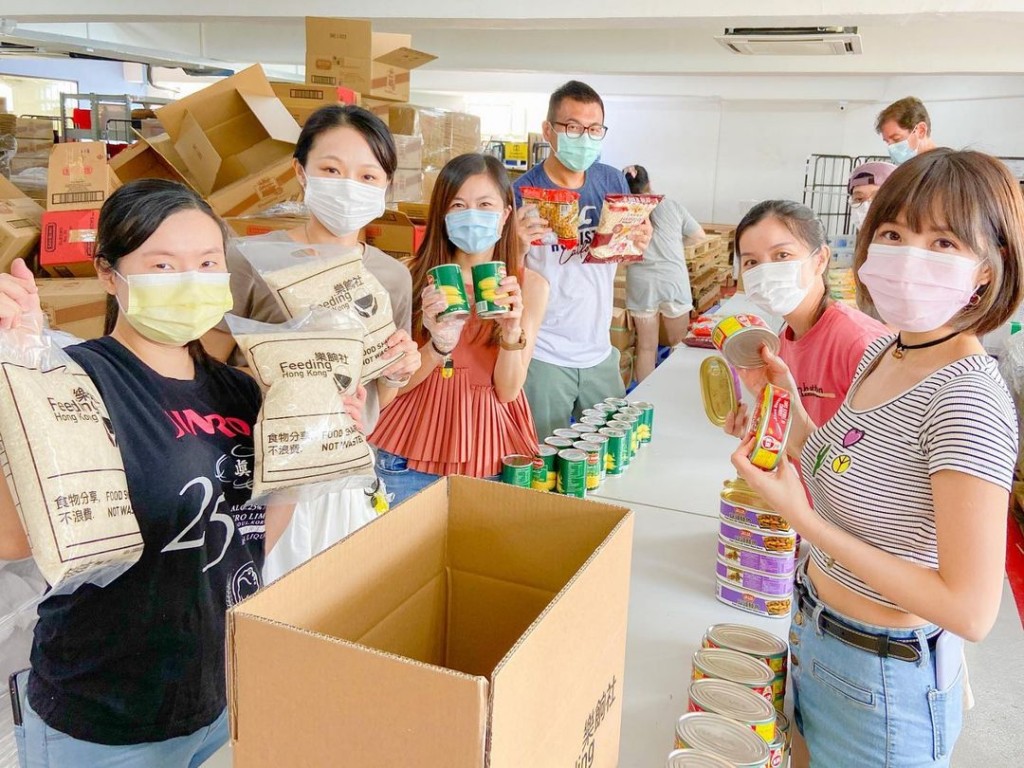 People participating in a food drive as part of their volunteer work in Hong Kong