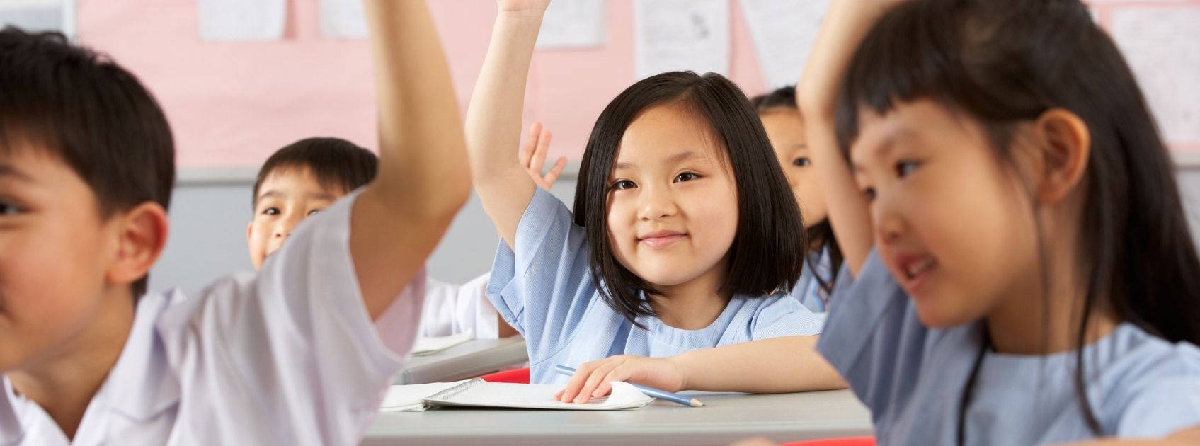 Student raising hand in Hong Kong education system