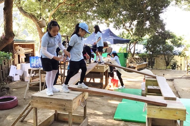 Students playing outside at Wycombe Abbey School Hong Kong