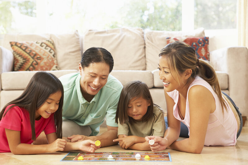 family playing board games together