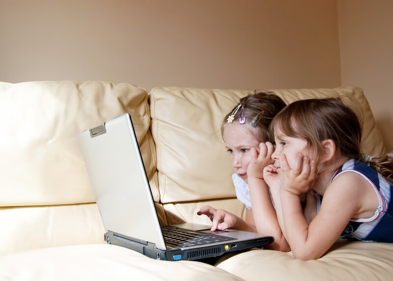 Two,Young,Girls,Surfing,The,Wold,Wide,Web,With,Laptop
