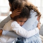 Black,African,Mother,Embrace,Little,Preschool,Frustrated,Kid,Sitting,On