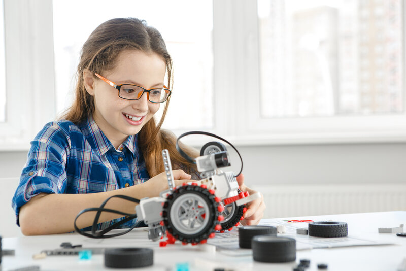 girl playing with stem toys