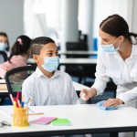 Hygiene,And,Cleaning.,Teacher,Cleaning,Table,With,Antibacterial,Sanitizer,And