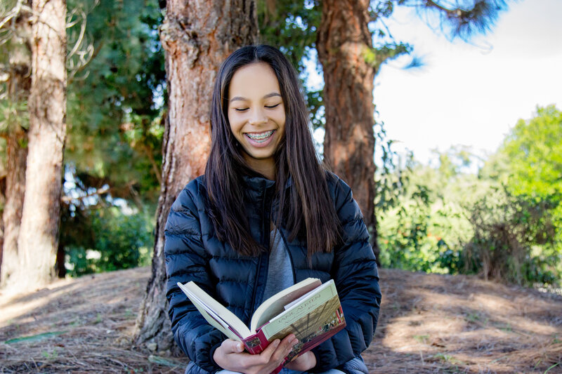 girl enjoying book at lindamood-bell