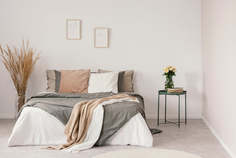 a bed with a side table