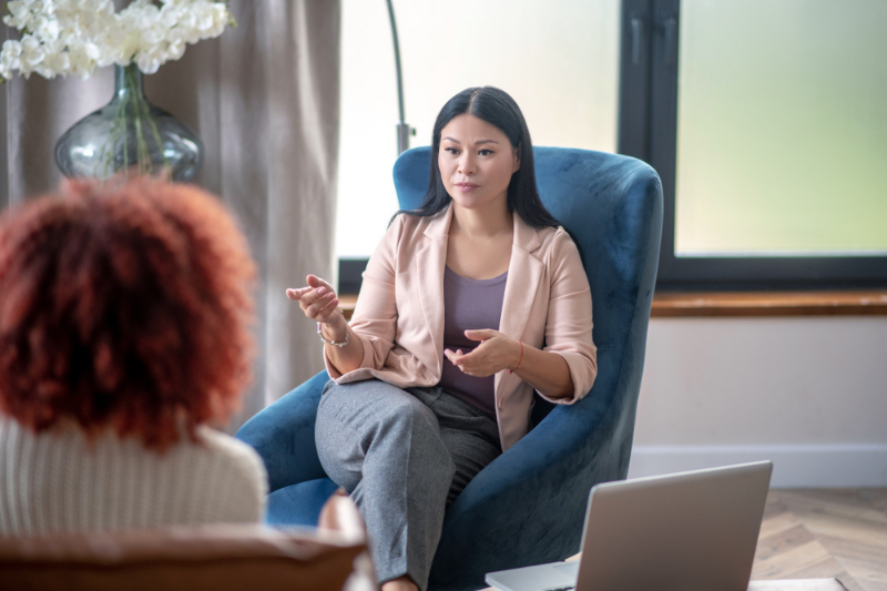 woman talking to therapist