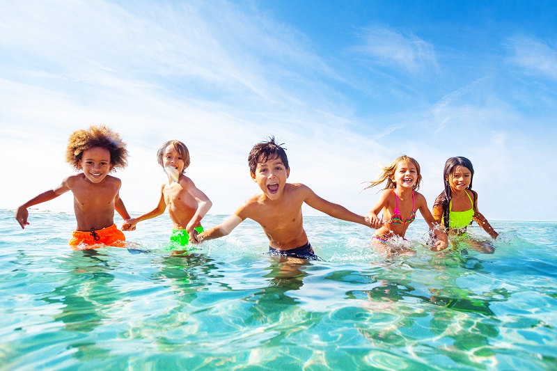Kids swimming together over the summer