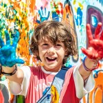 Happy,Cute,Boy,With,Painted,Paint,Palms,Outstretched,Ahead.,Happy
