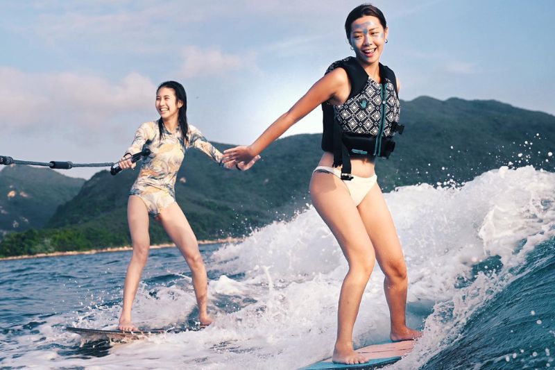 Two women doing water ski in Hong Kong